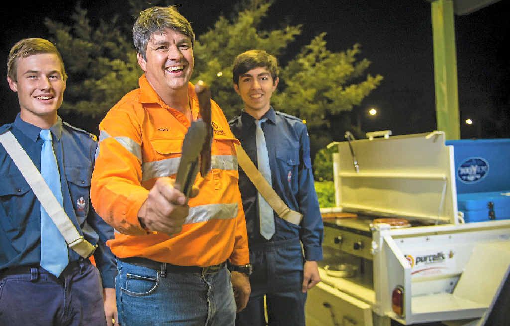 BEAUT BARBIE: Michael Ruge, 17, Terry Purcell and Ben O’Driscoll, 16, enjoy a sausage sizzle at the Gladstone Baptist Church. BEAUT BARBIE: Michael Ruge, 17, Terry Purcell and Ben O’Driscoll, 16, enjoy a sausage sizzle at the Gladstone Baptist Church.